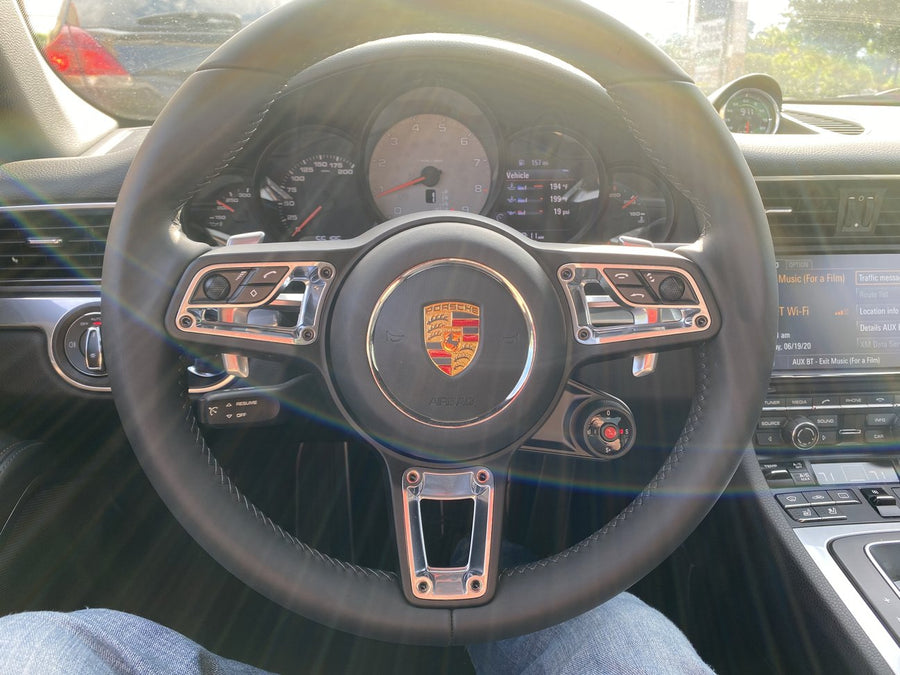 Porsche steering wheel with multifunction controls and Mode Switch dial
